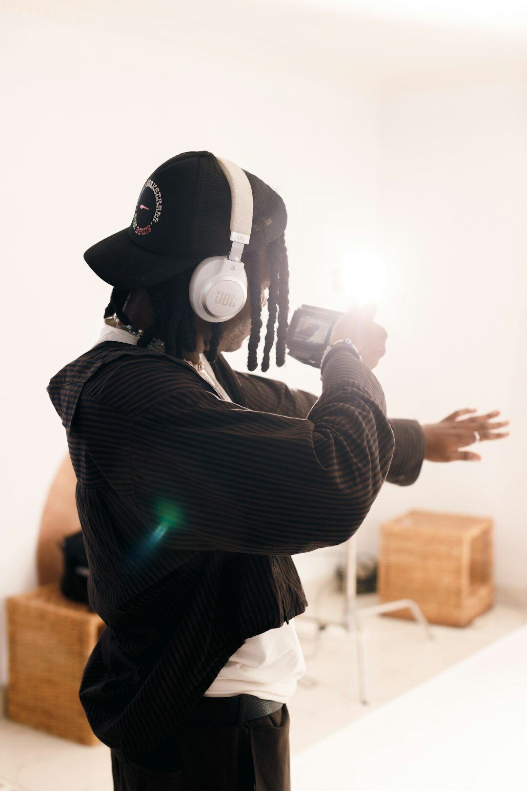 Woman recording a podcast in a studio with headphones and microphone